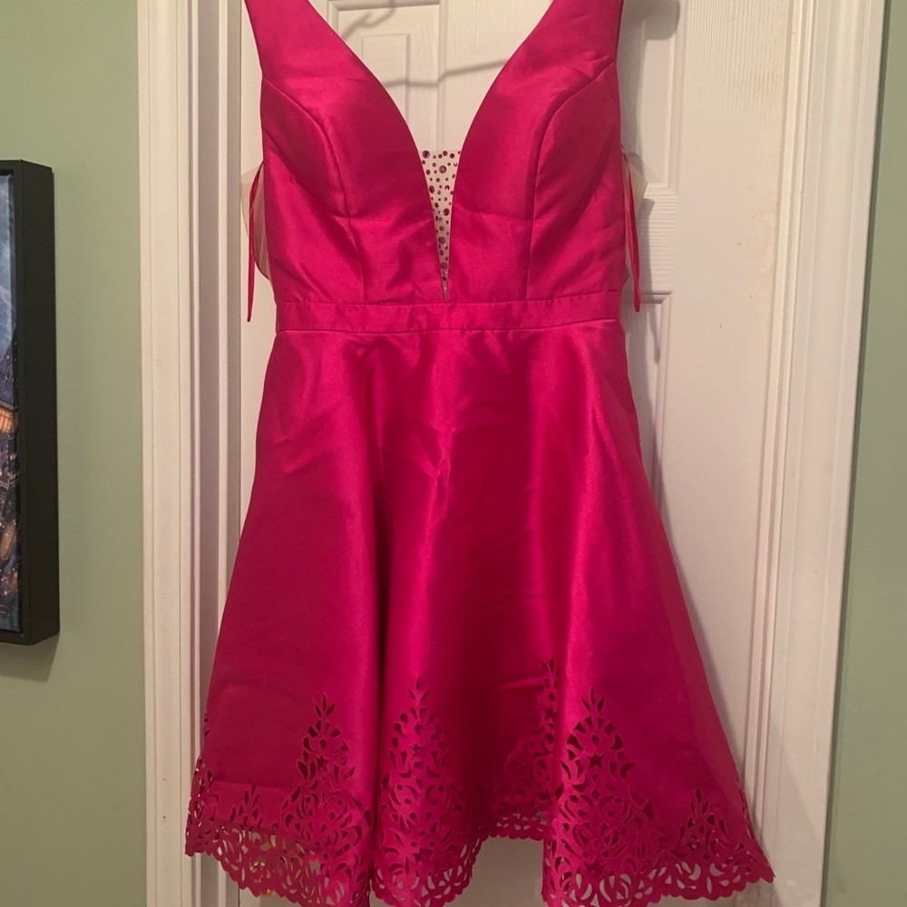 Pink cocktail dress with rhinestones added to the bodice